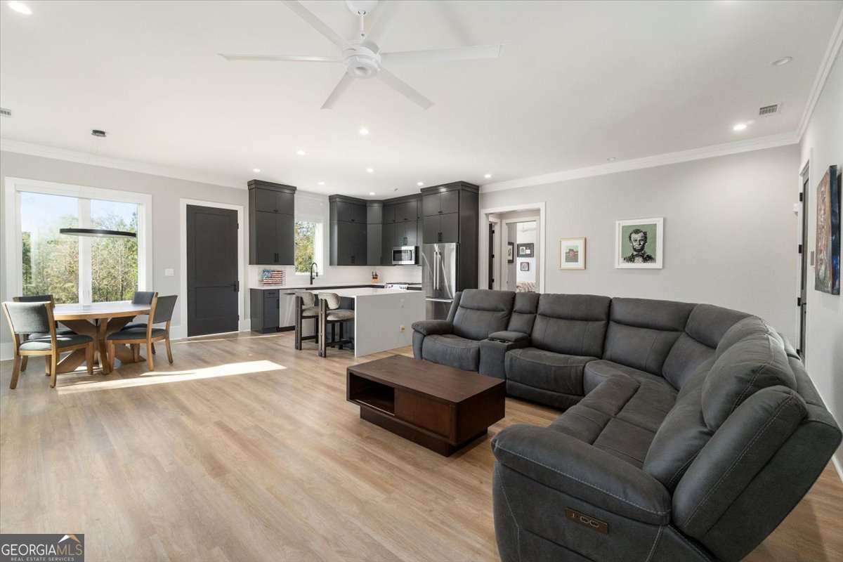 60 Stephens Road Lexington, GA 30648 - Photo 10 of 60 a living room with fireplace furniture and a wooden floor