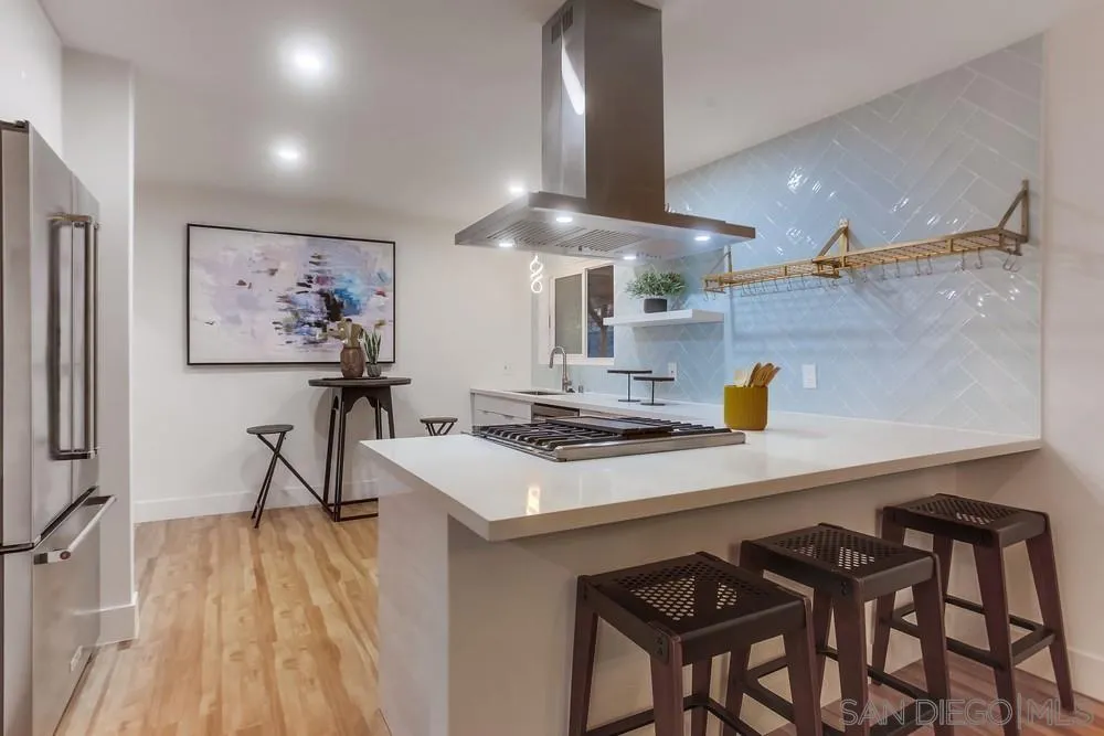 1822 Ivy Road Oceanside, CA 92054 - Photo 14 of 30 a kitchen with a sink a stove and chairs