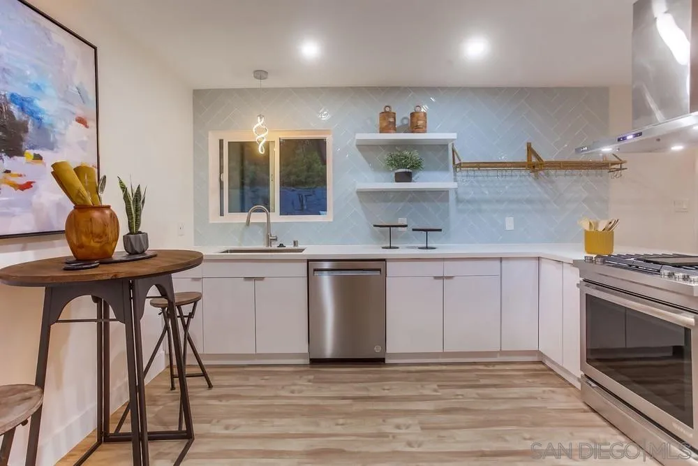 1822 Ivy Road Oceanside, CA 92054 - Photo 16 of 30 a kitchen with a sink cabinets and stainless steel appliances