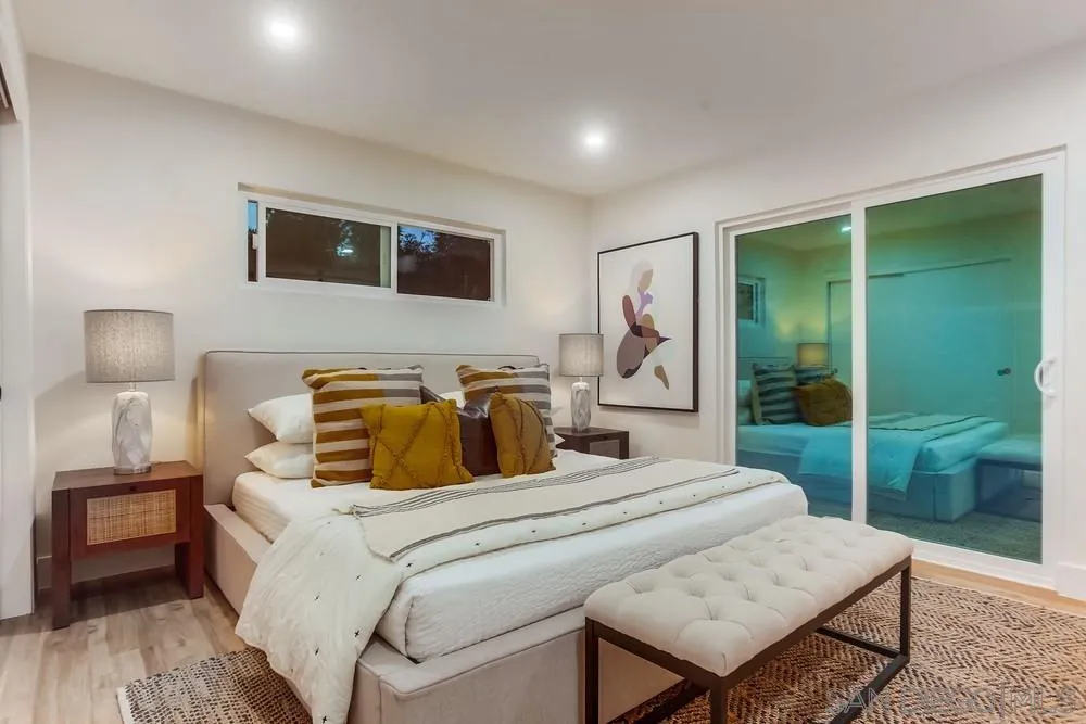 1822 Ivy Road Oceanside, CA 92054 - Photo 19 of 30 a bedroom with a bed and wooden floor