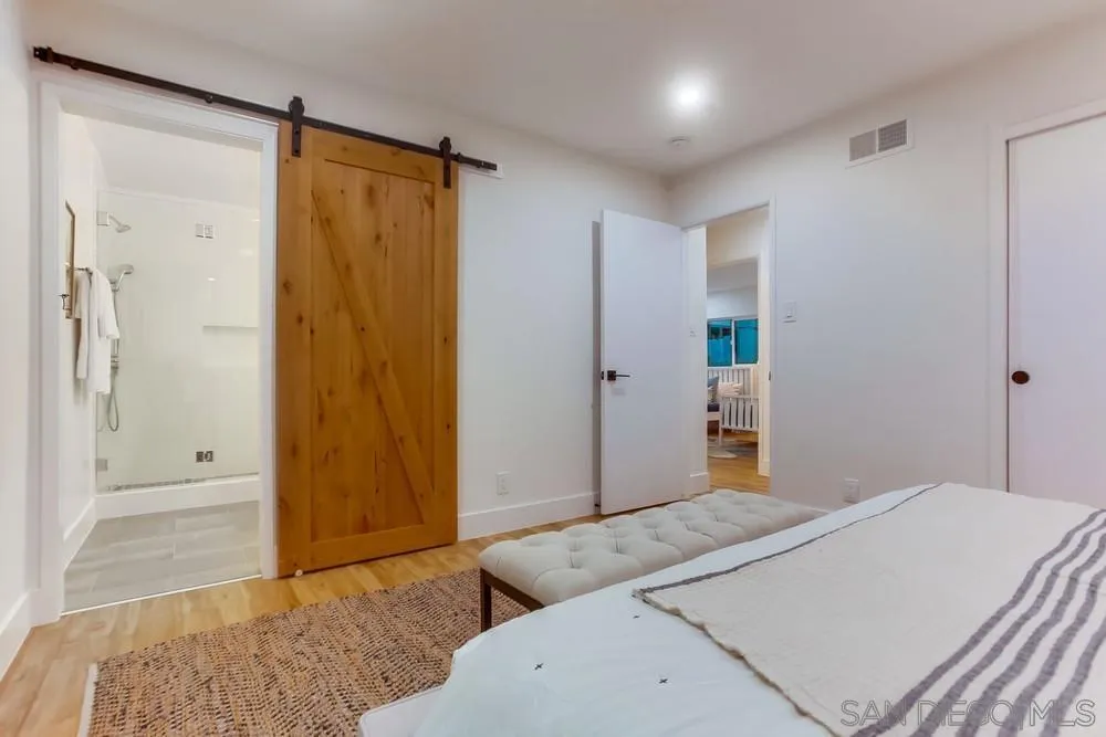 1822 Ivy Road Oceanside, CA 92054 - Photo 20 of 30 a bedroom with a bed and a shower