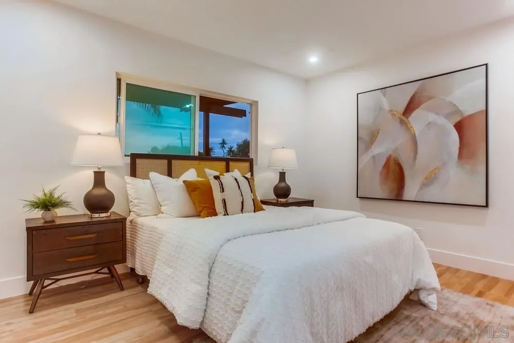 1822 Ivy Road Oceanside, CA 92054 - Photo 22 of 30 a bedroom with bed and wooden floor