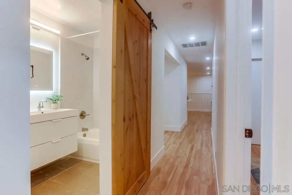1822 Ivy Road Oceanside, CA 92054 - Photo 23 of 30 a bathroom with a vanity and mirror