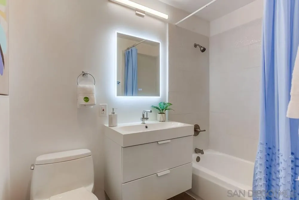 1822 Ivy Road Oceanside, CA 92054 - Photo 24 of 30 a bathroom with a sink a toilet and shower