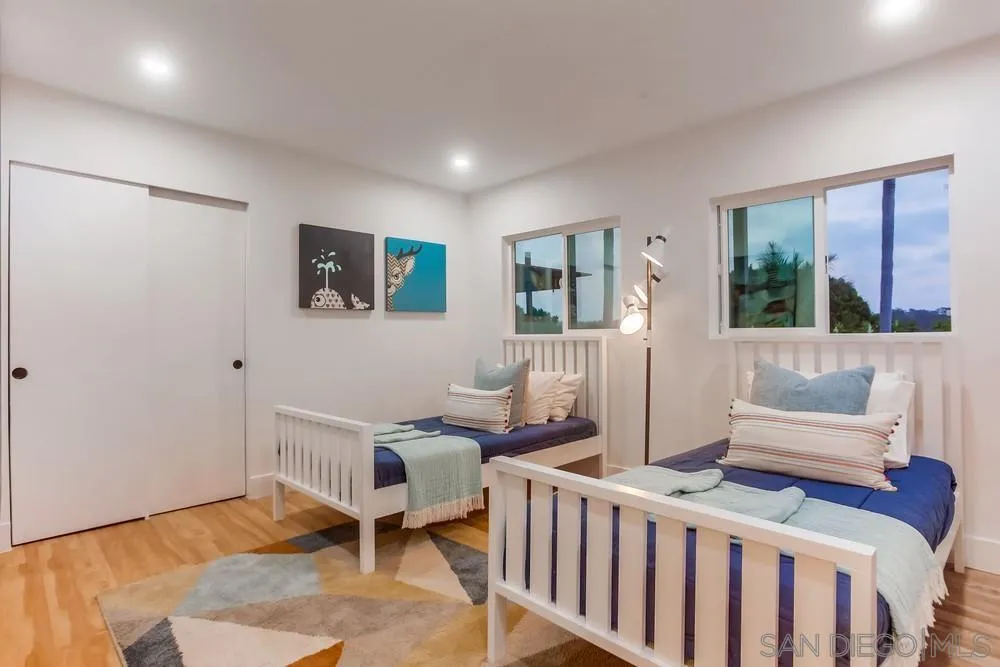 1822 Ivy Road Oceanside, CA 92054 - Photo 25 of 30 a living room with furniture and large windows