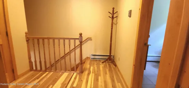 a view of balcony with wooden floor