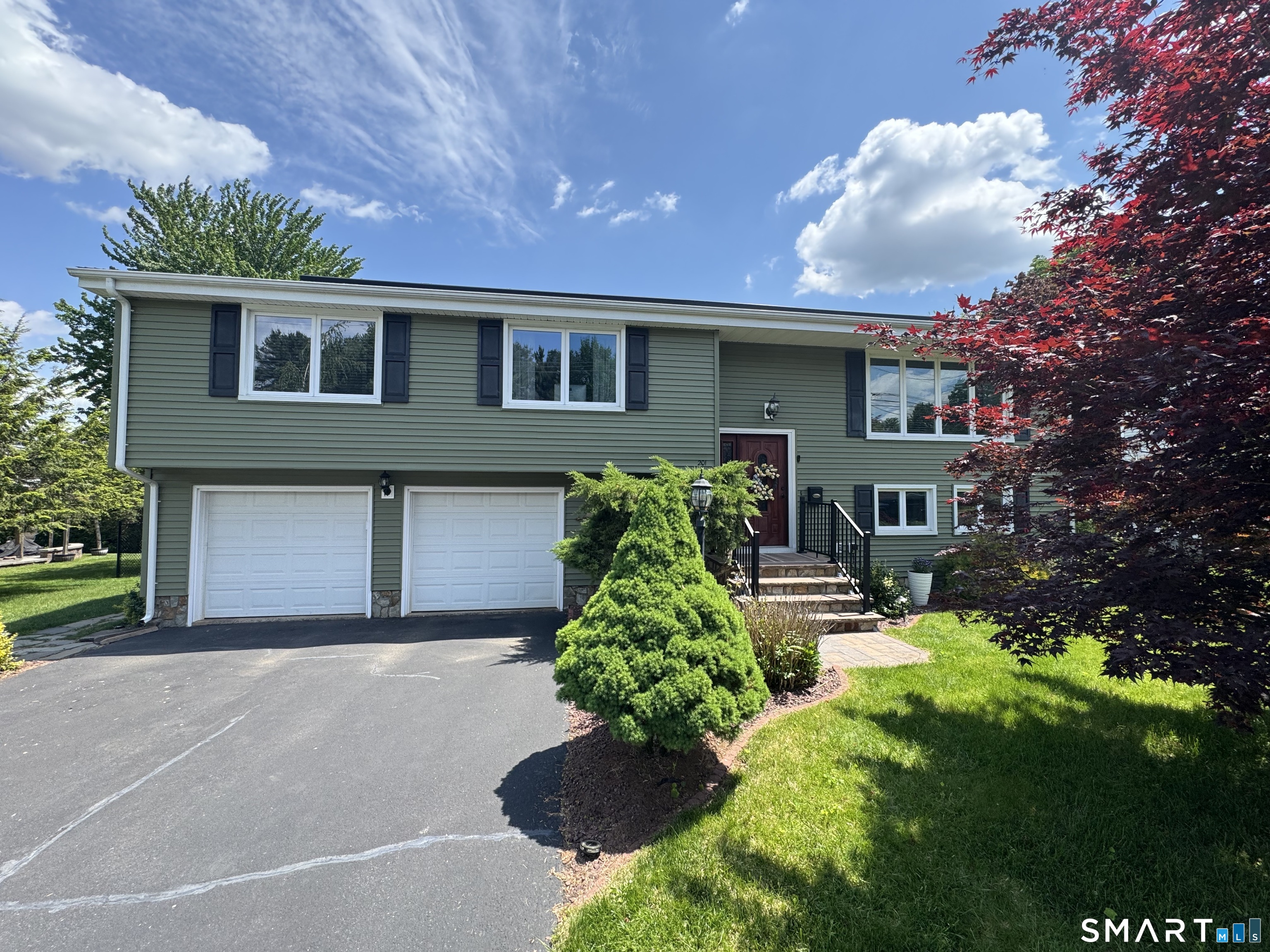201 Ridge Crest Circle Wethersfield, CT 06109 - Photo 1 of 35 a front view of a house with garden