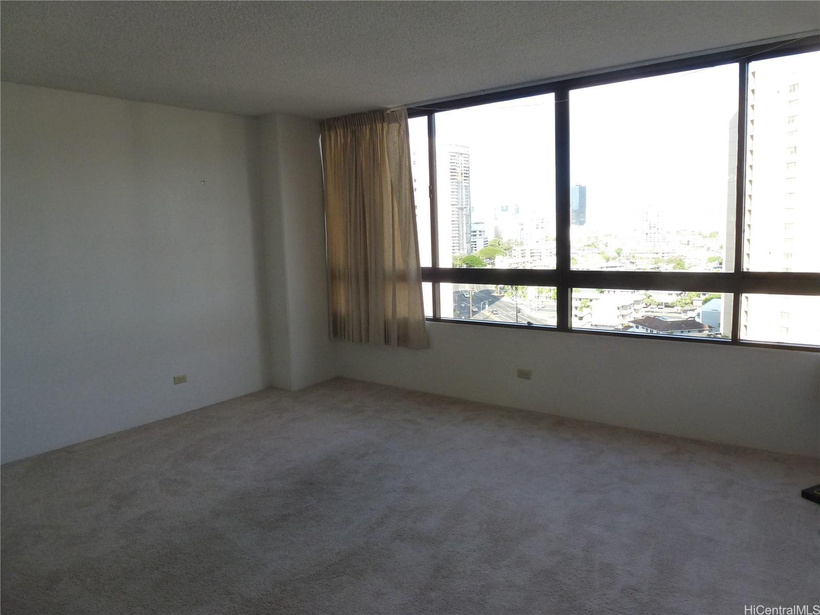 2499 Kapiolani Boulevard, Unit 1102 Honolulu, HI 96826 - Photo 1 of 4 an empty room with a window