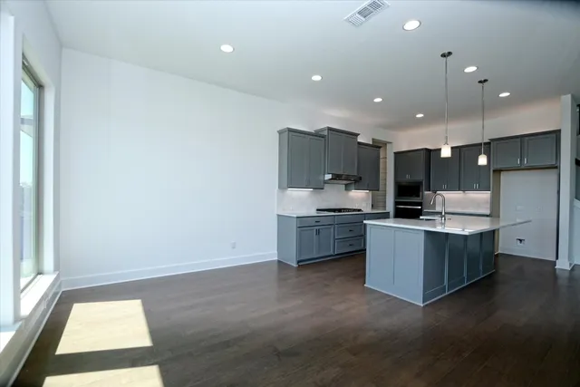 a bathroom with a sink and mirror