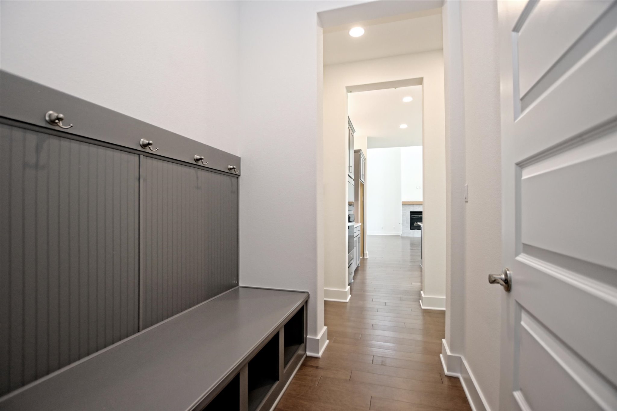 1209 Stormy Drive Georgetown, TX 78628 - Photo 15 of 38 a view of a hallway with a door and wooden floor