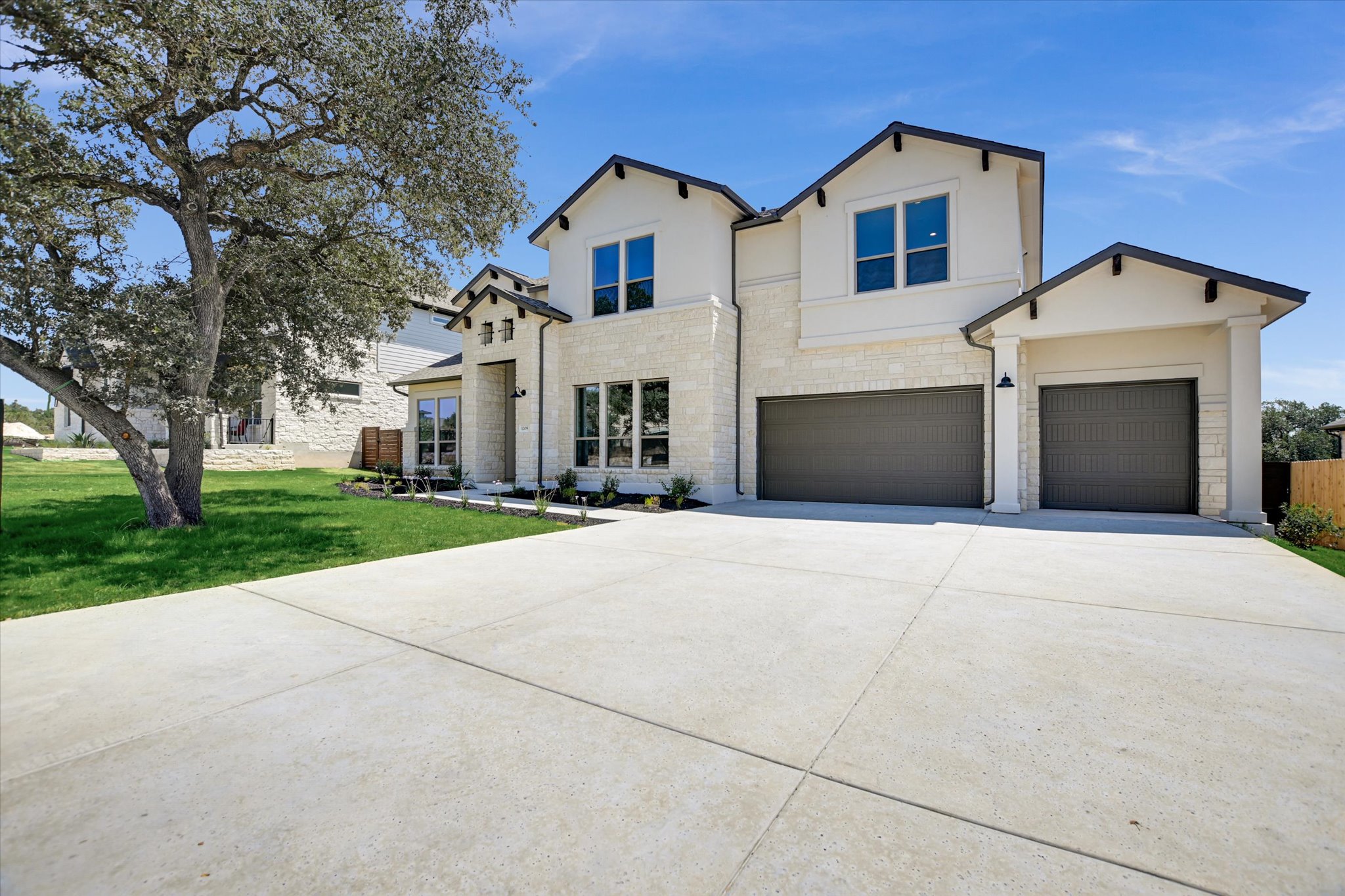 1209 Stormy Drive Georgetown, TX 78628 - Photo 2 of 38 a front view of a house with a yard and garage