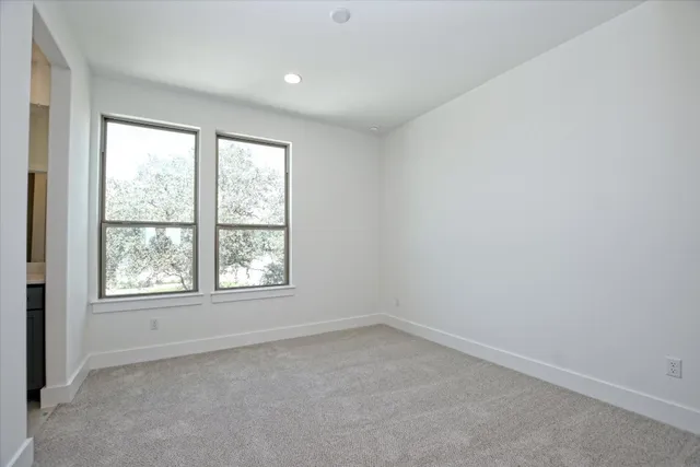 a house view with a sitting space and garden