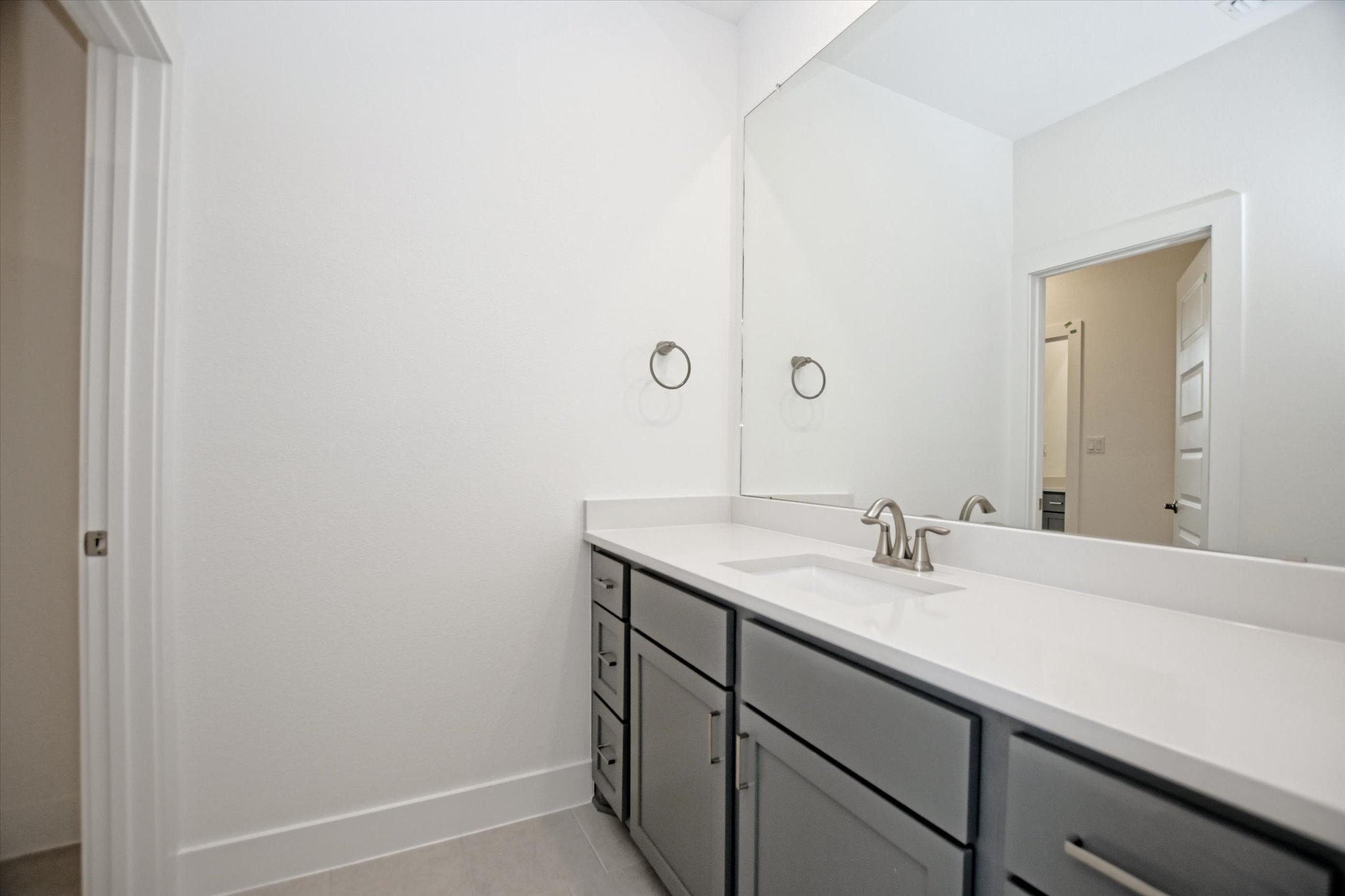 1209 Stormy Drive Georgetown, TX 78628 - Photo 30 of 38 a bathroom with a sink and a mirror