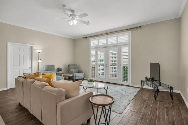 a living room with furniture and a large window