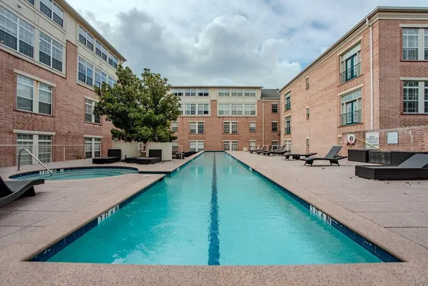 a view of swimming pool with outdoor seating