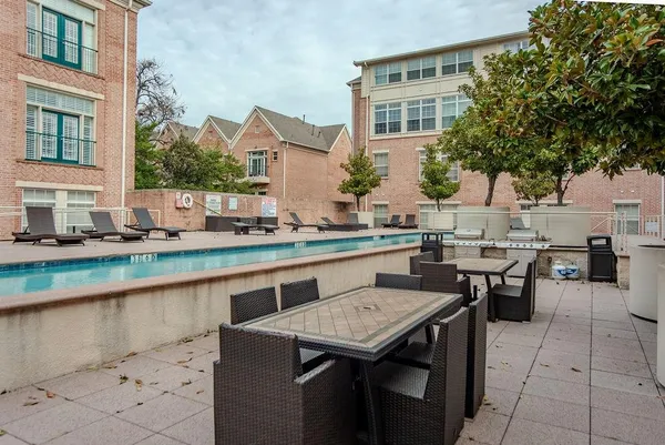 a backyard of a house with a table and chairs