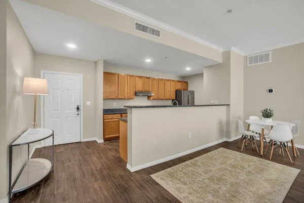 a view of kitchen with cabinets and wooden floor