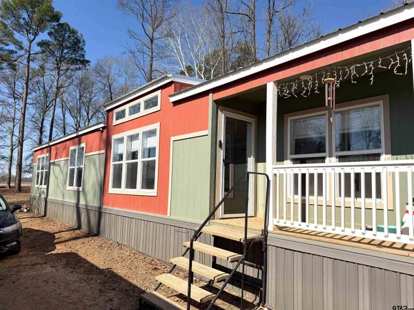 a view of a dining room with furniture and window