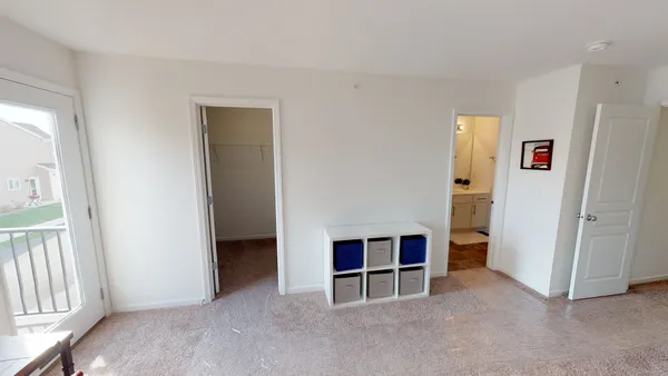 a view of work space with windows and wardrobe