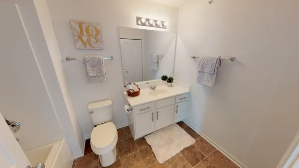a bathroom with a sink and toilet