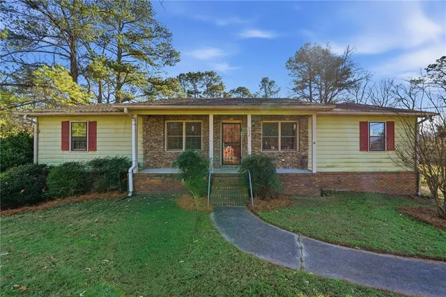 front view of a house with a yard