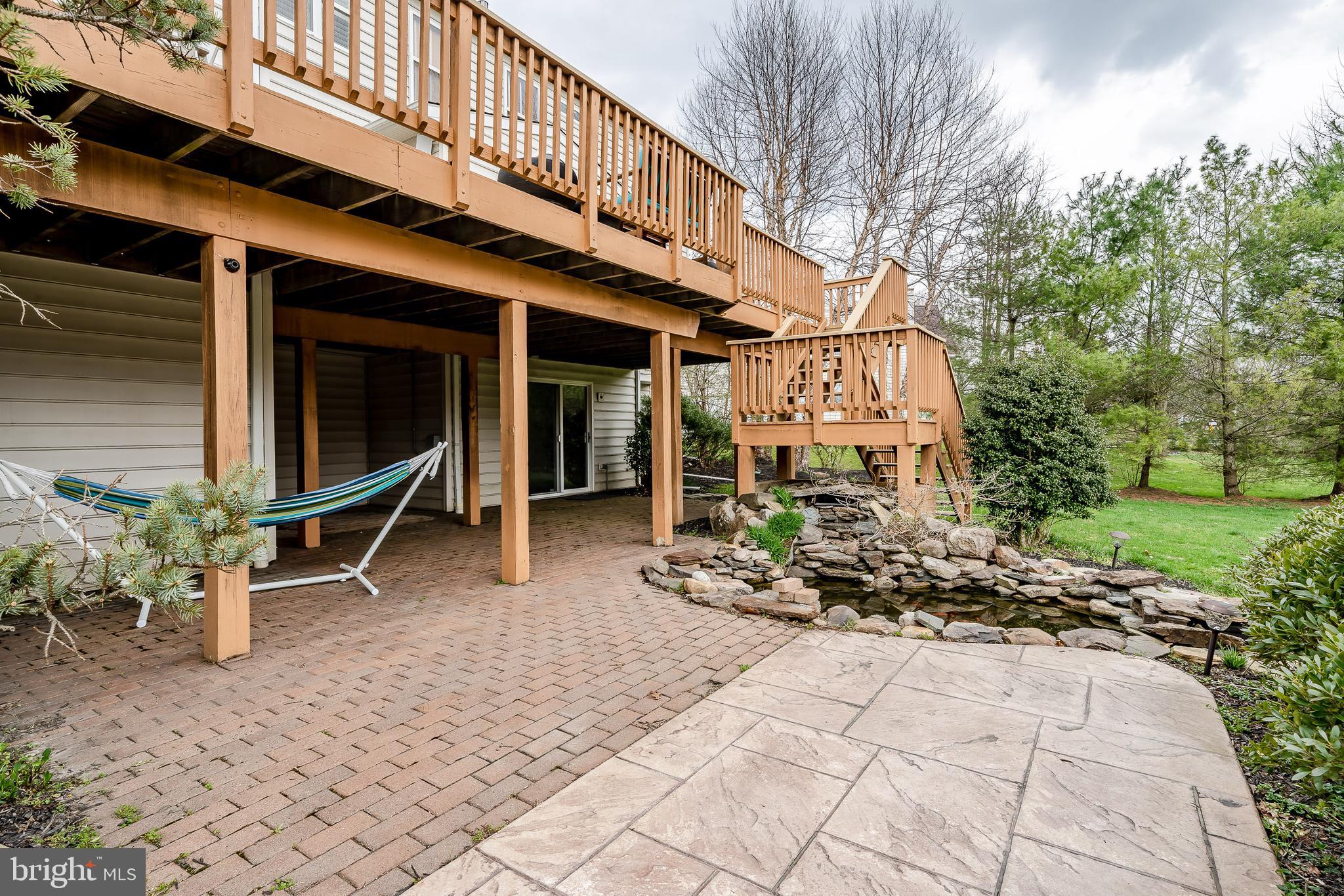 202 Green Valley Road Exton, PA 19341 - Photo 26 of 32 Lover Level Concrete and paver patio and koi pond
