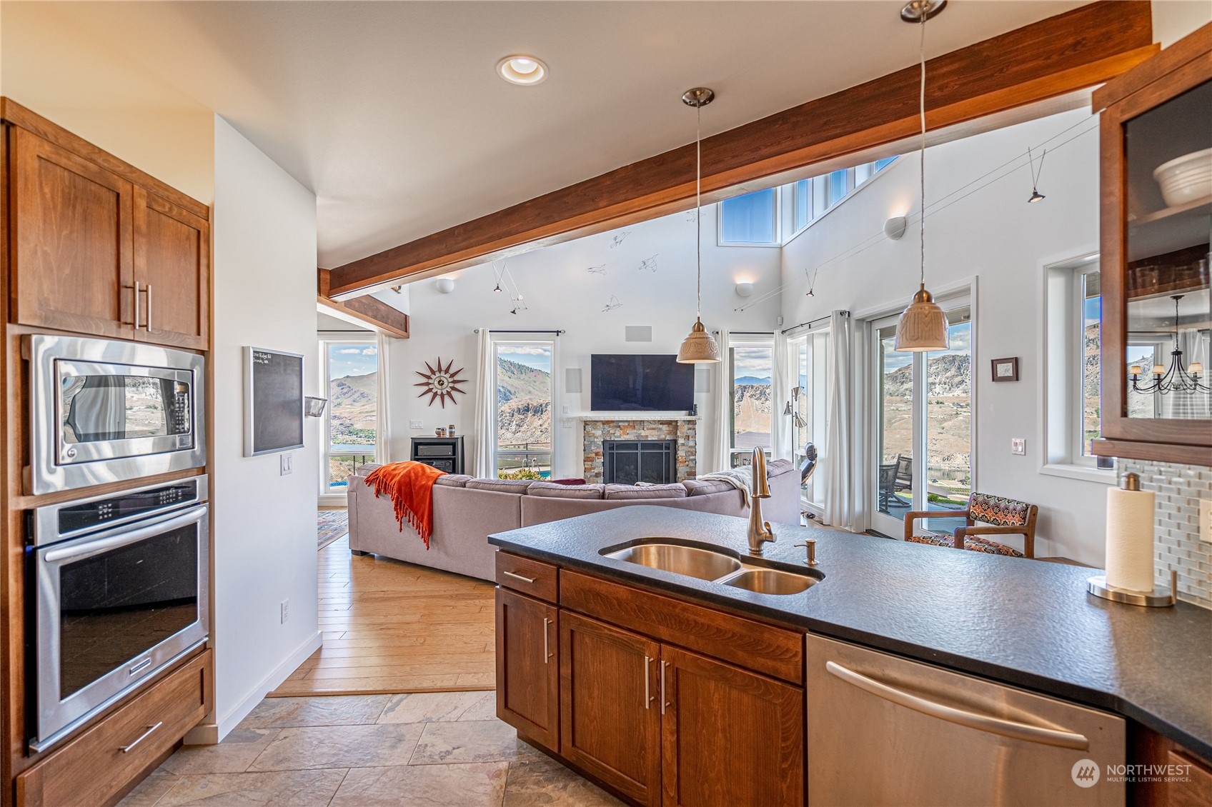 200 Ridge Road Orondo, WA 98843 - Photo 13 of 40 a kitchen with stainless steel appliances sink stove and cabinets