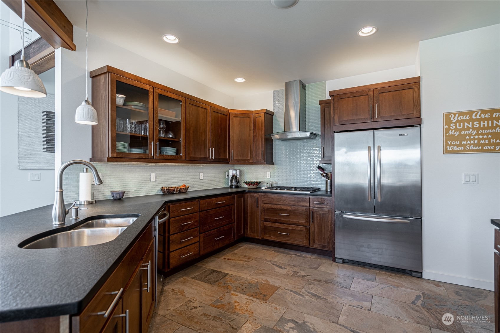 200 Ridge Road Orondo, WA 98843 - Photo 15 of 40 a kitchen with granite countertop a refrigerator and a sink
