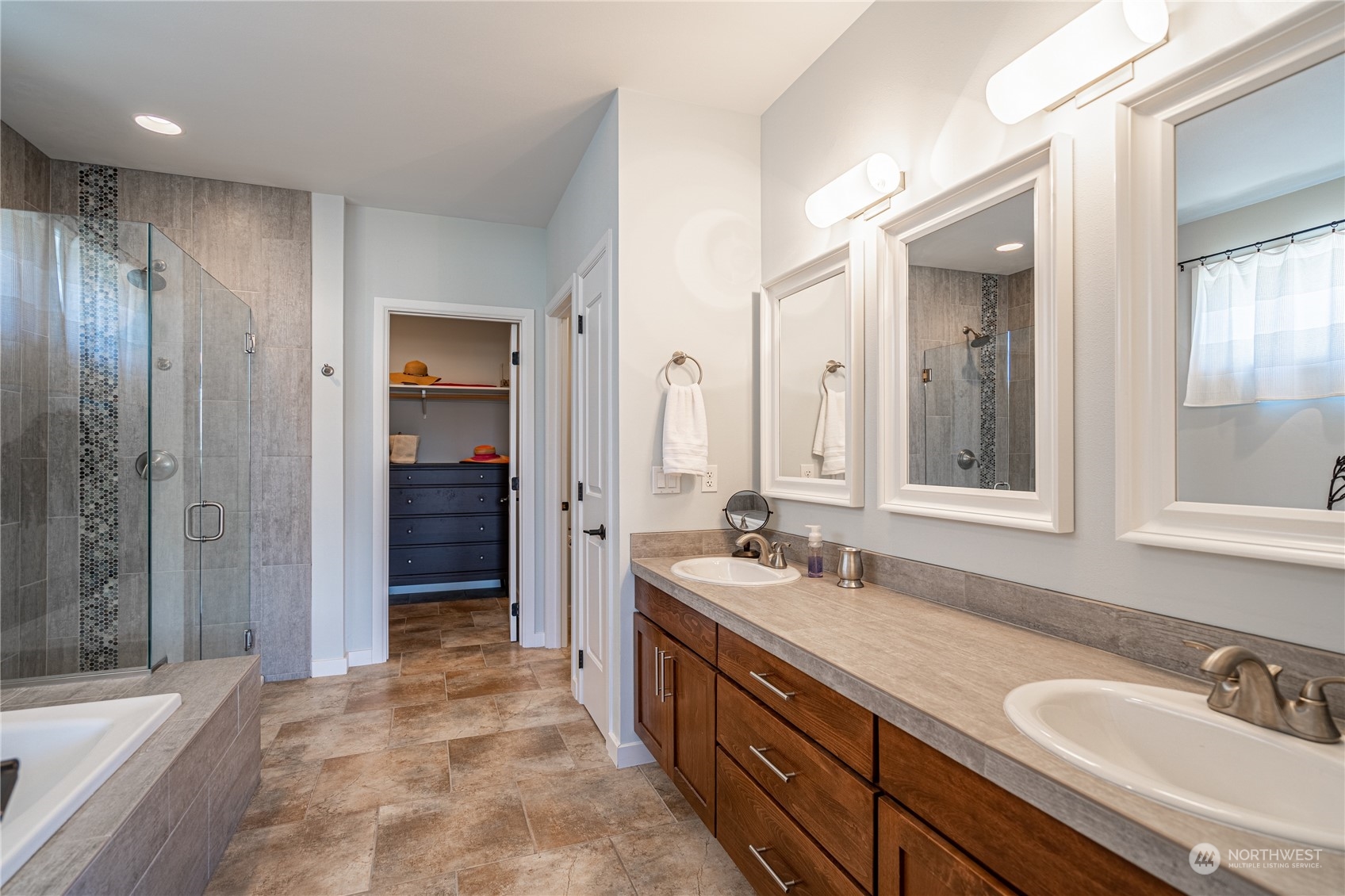 200 Ridge Road Orondo, WA 98843 - Photo 18 of 40 a spacious bathroom with a double vanity sink mirror and shower