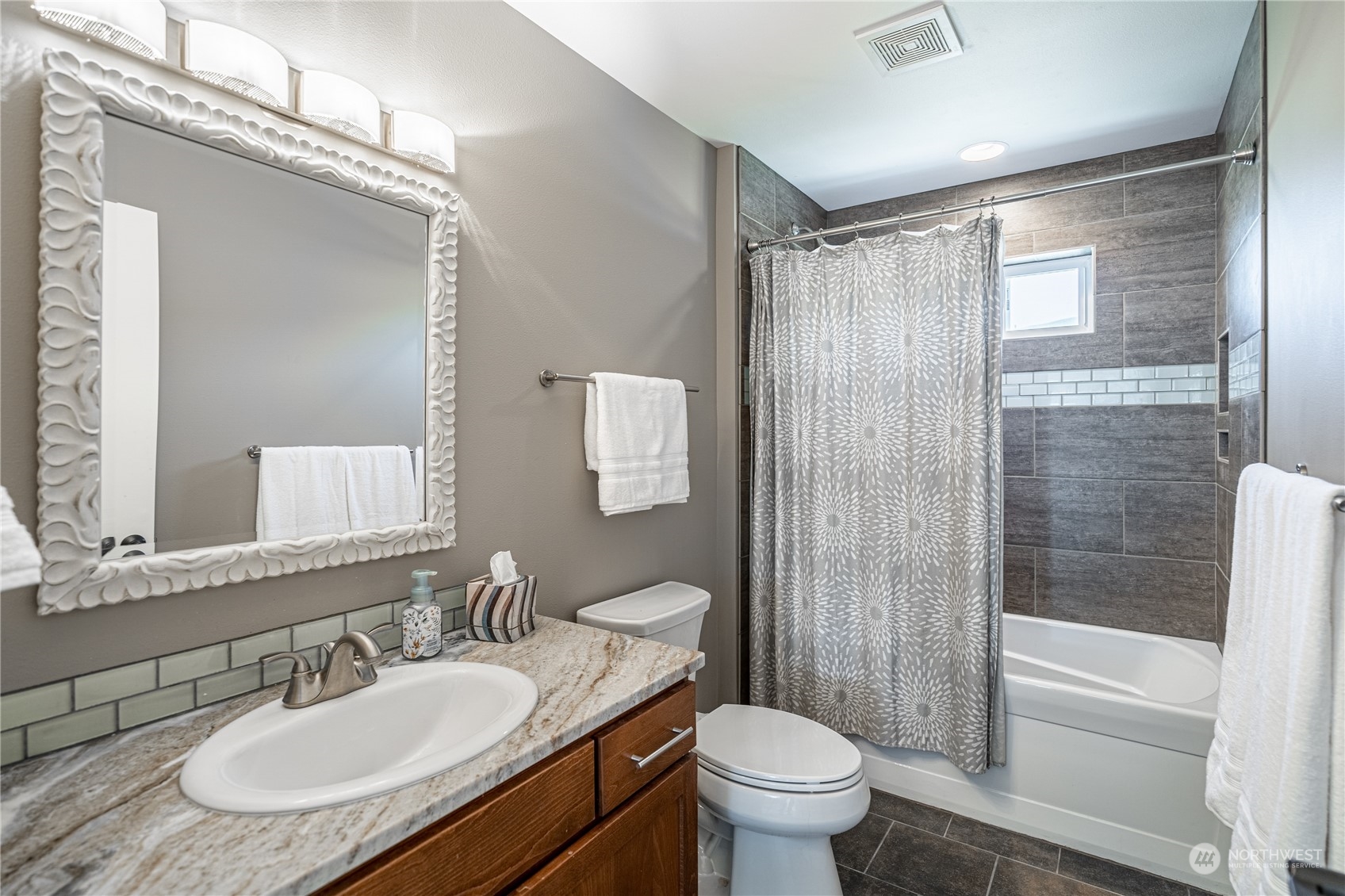 200 Ridge Road Orondo, WA 98843 - Photo 26 of 40 a bathroom with a granite countertop sink toilet a mirror and shower