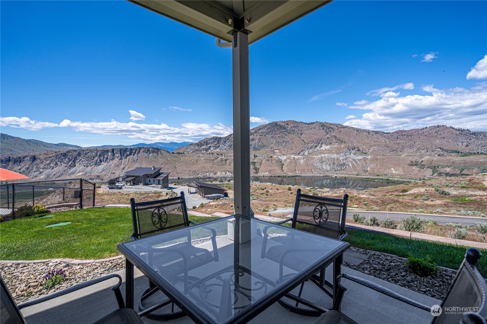 200 Ridge Road Orondo, WA 98843 - Photo 28 of 40 a view of a terrace with furniture and a yard
