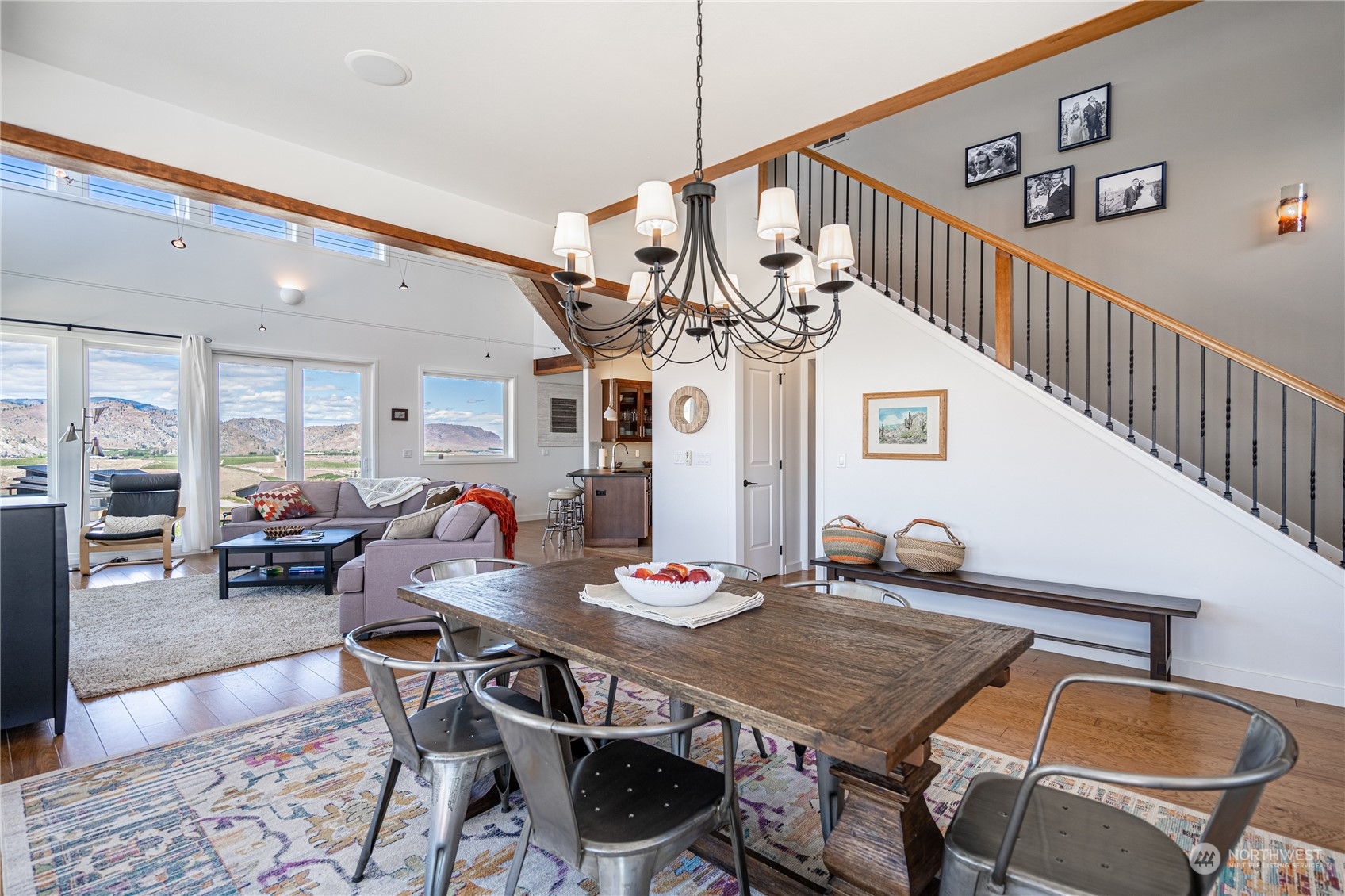 200 Ridge Road Orondo, WA 98843 - Photo 5 of 40 a view of a dining room and livingroom with furniture wooden floor and a rug