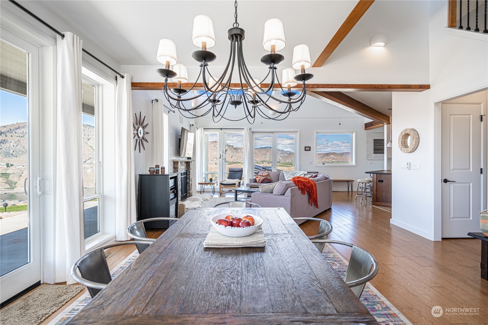 200 Ridge Road Orondo, WA 98843 - Photo 8 of 40 a living room with furniture kitchen view and a wooden floor
