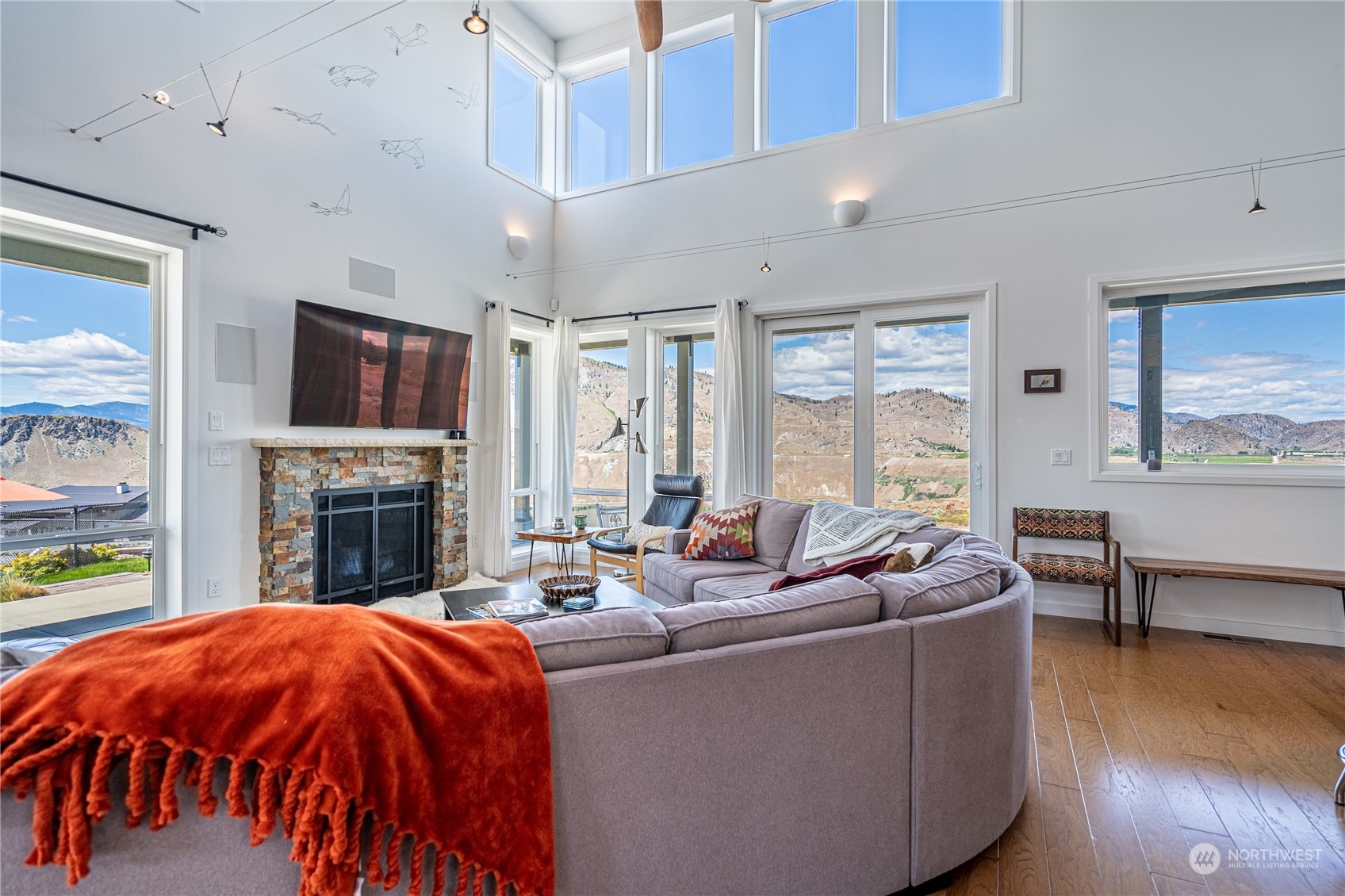 200 Ridge Road Orondo, WA 98843 - Photo 10 of 40 a living room with fireplace furniture and a flat screen tv