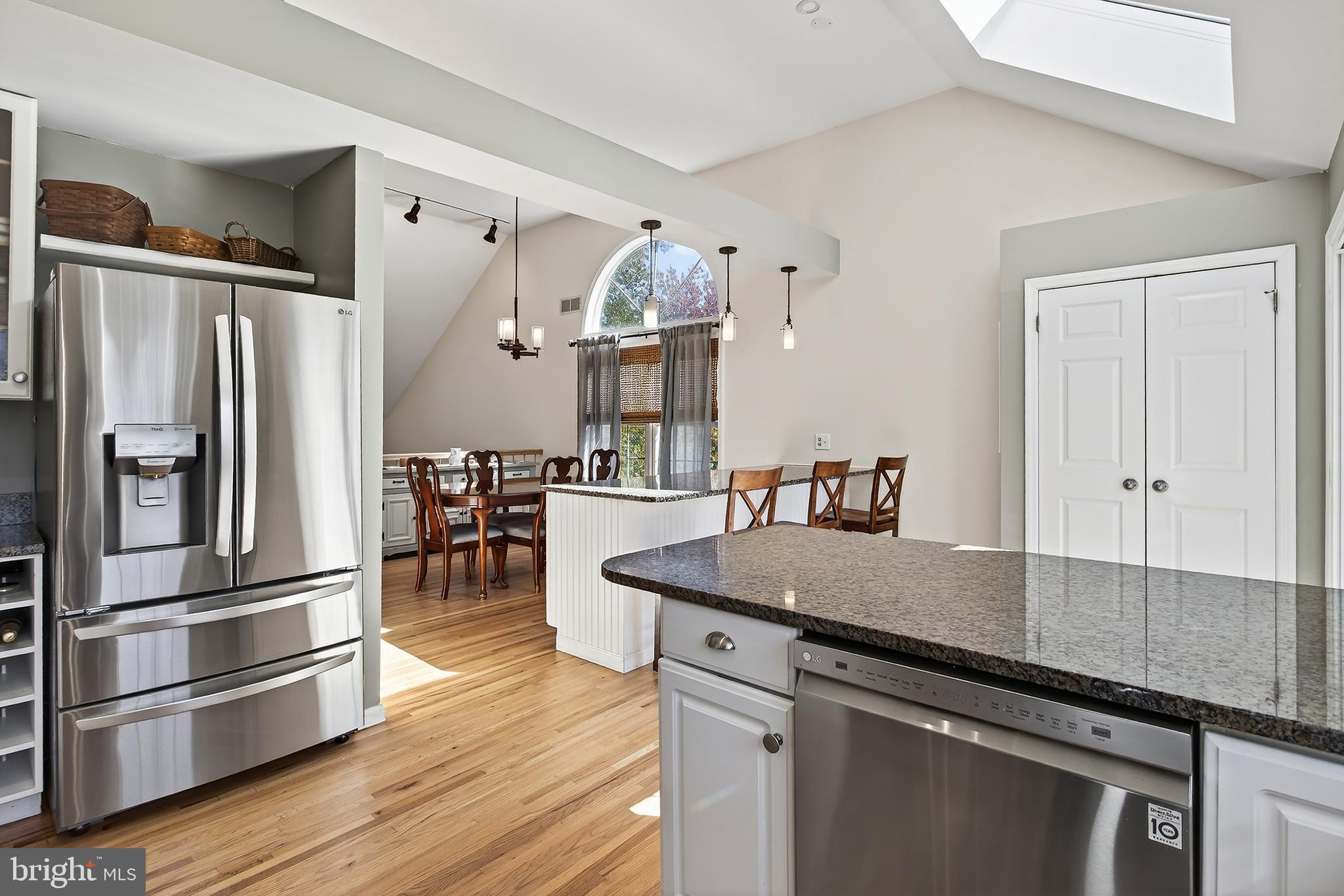17 Elm Street Hopewell, NJ 08525 - Photo 18 of 52 a kitchen with granite countertop a refrigerator and a stove top oven