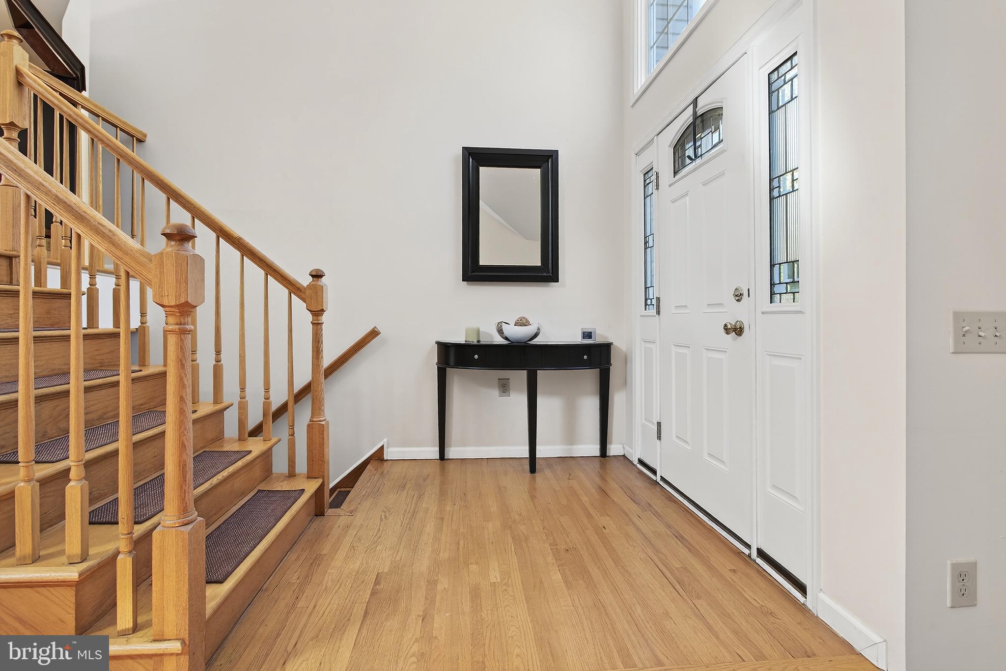 17 Elm Street Hopewell, NJ 08525 - Photo 6 of 52 a view of a hallway with wooden floor and staircase