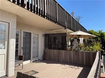 a balcony view with a backyard space