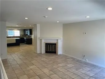 a view of entryway and hall with a living room