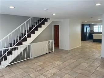 a kitchen with granite countertop a sink and a stove top oven
