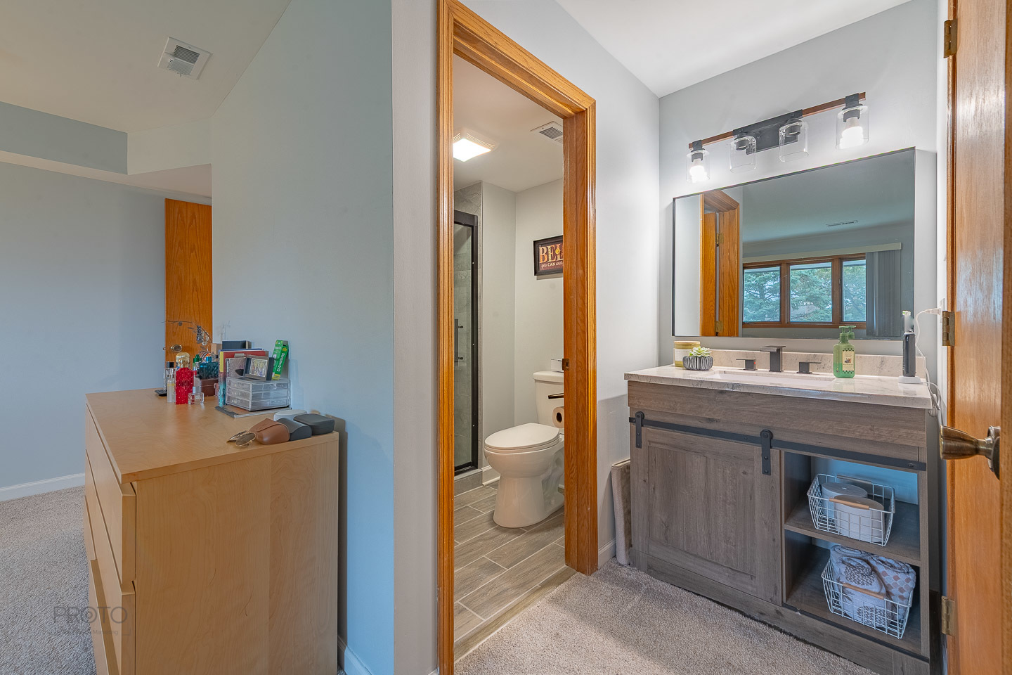 11015 South 84th Avenue, Unit 3C Palos Hills, IL 60465 - Photo 20 of 30 a bathroom with a granite countertop sink mirror and a toilet