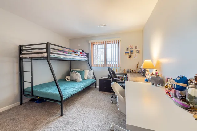 a bedroom with bed and window