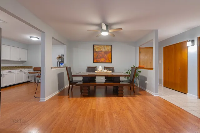 a living room with furniture and a kitchen view