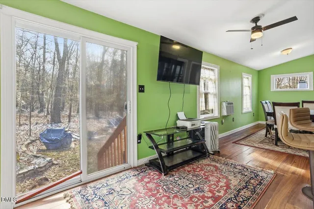 a living room with furniture and a rug