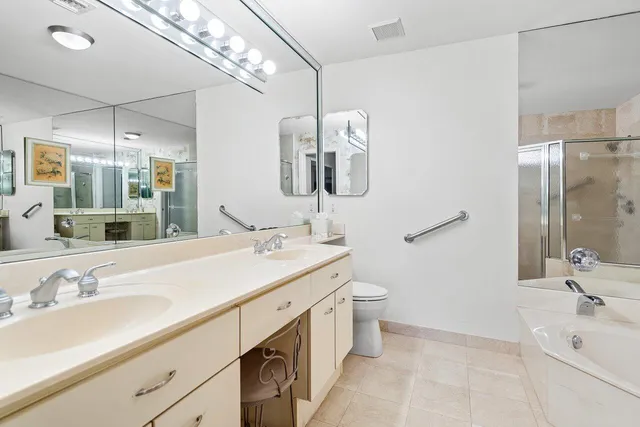 a bathroom with a sink double vanity and a mirror