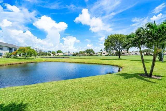 a view of a lake with houses in the background