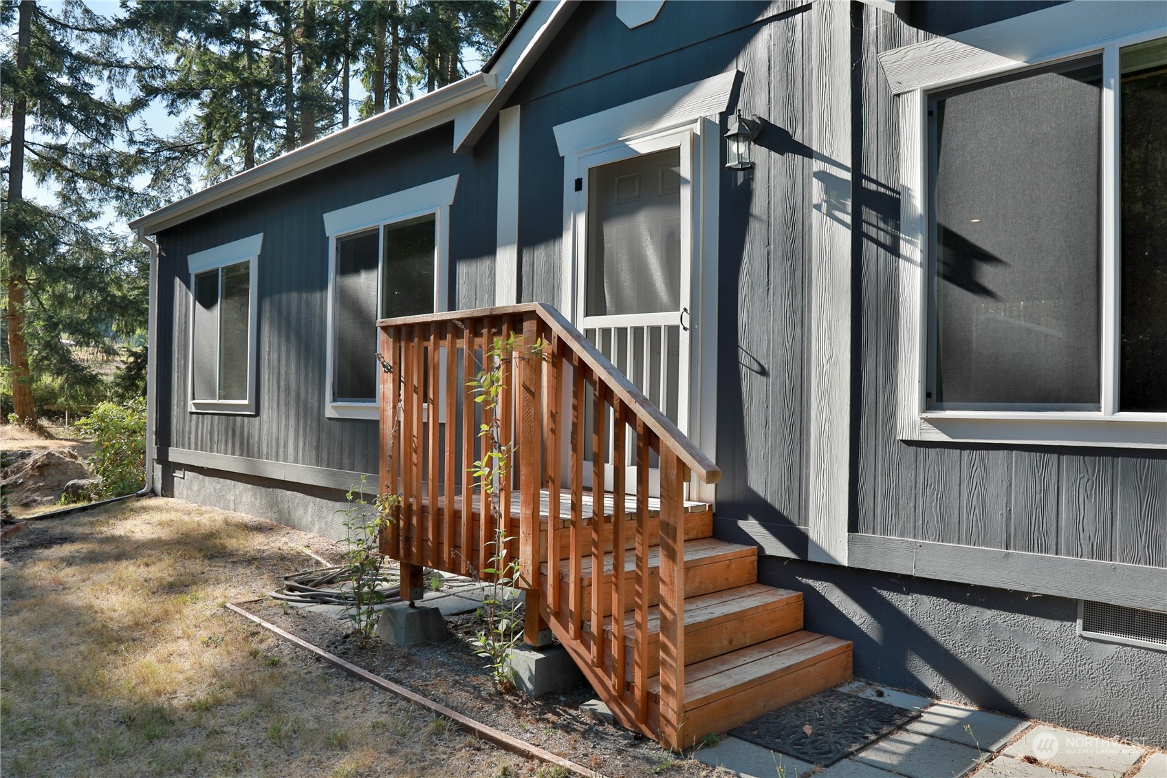 2811 East Andreason Road Langley, WA 98260 - Photo 11 of 38 a view of backyard with deck and wooden floor