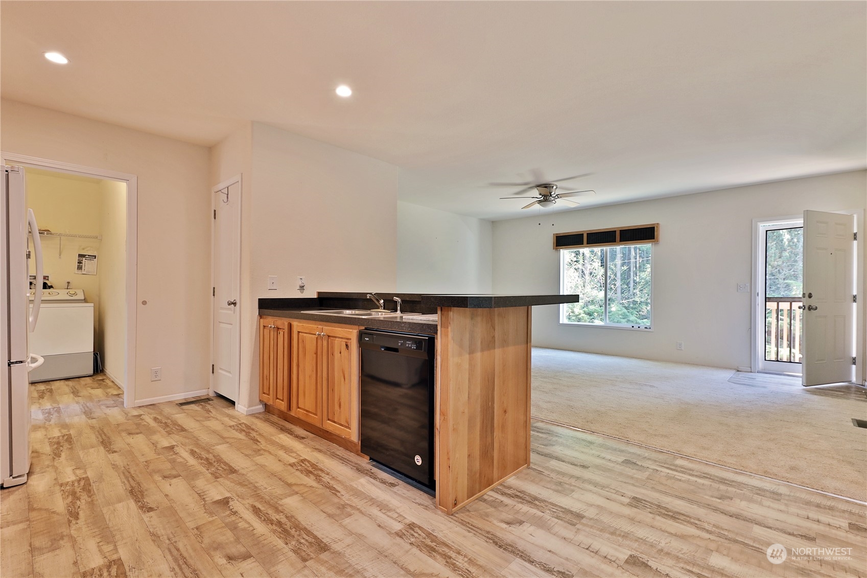 2811 East Andreason Road Langley, WA 98260 - Photo 14 of 38 a view of a kitchen with a sink and a window