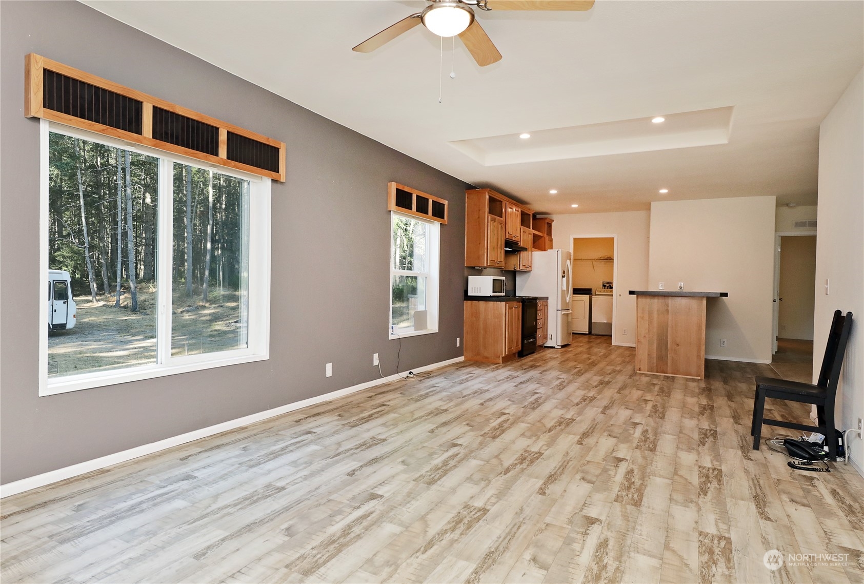 2811 East Andreason Road Langley, WA 98260 - Photo 15 of 38 a view of livingroom with furniture wooden floor and window
