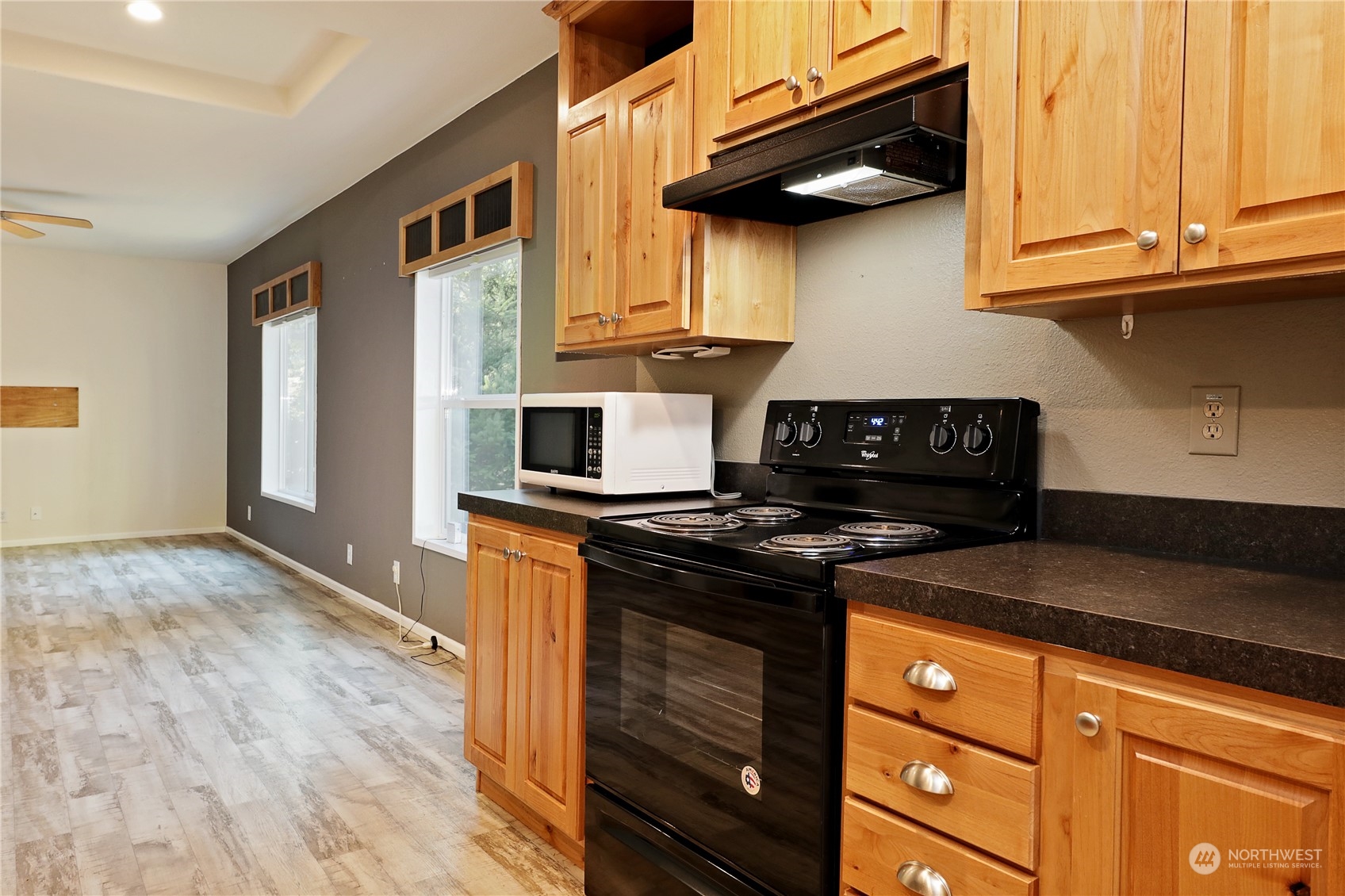 2811 East Andreason Road Langley, WA 98260 - Photo 17 of 38 a kitchen with stainless steel appliances granite countertop a stove and a refrigerator