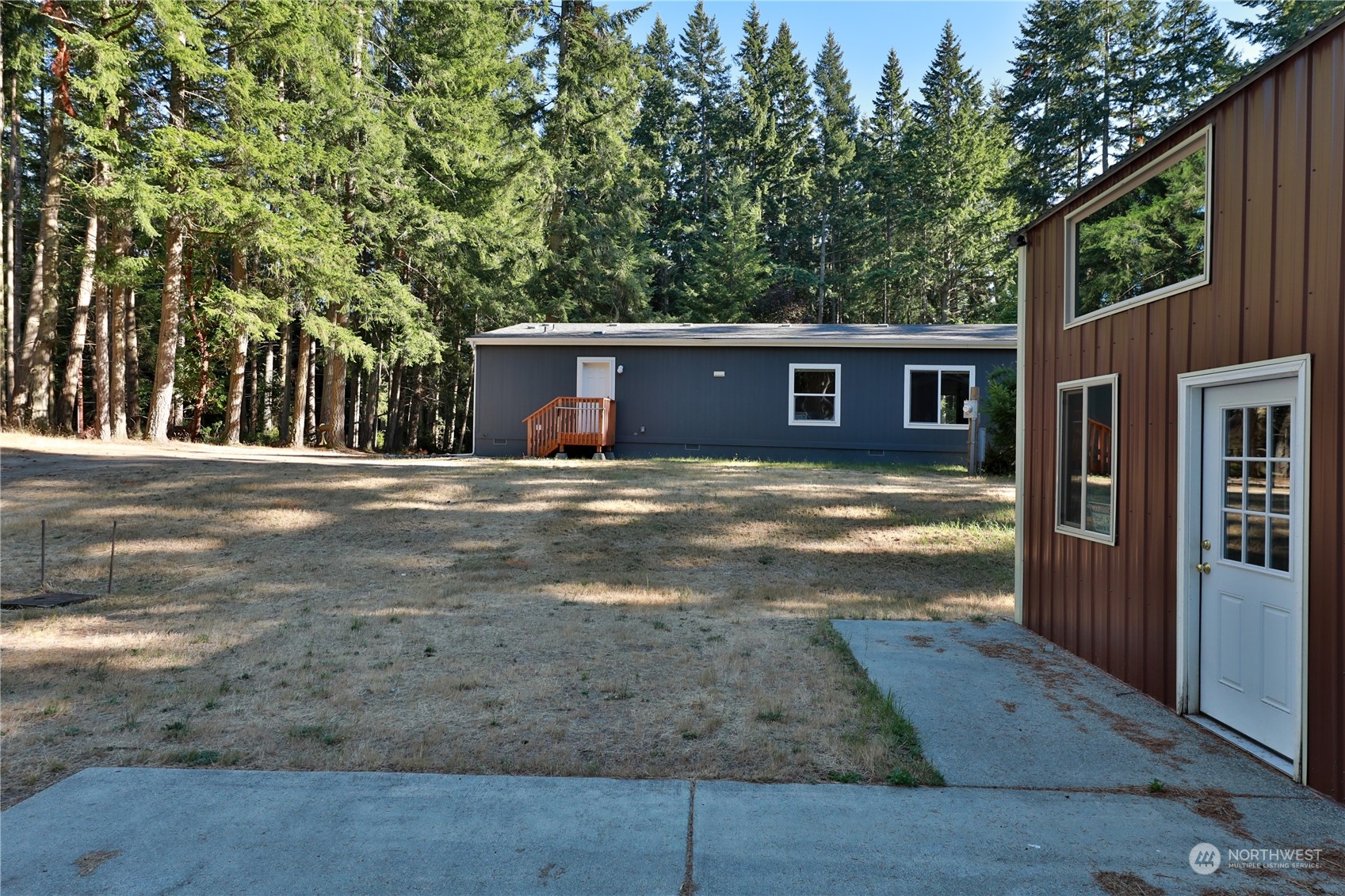 2811 East Andreason Road Langley, WA 98260 - Photo 8 of 38 a view of a house with backyard